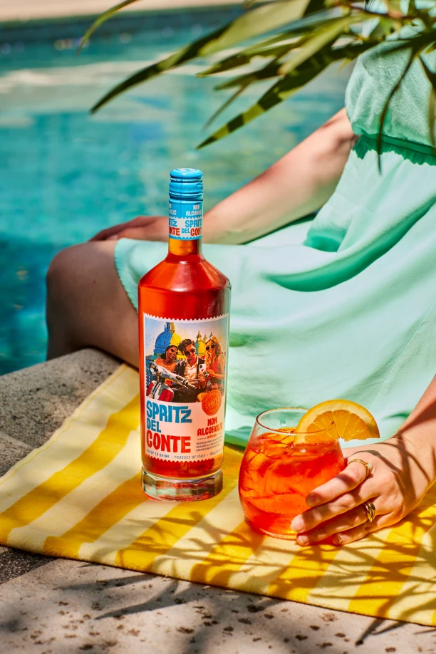 Someone enjoying Spritz Del Conte Classico by the pool