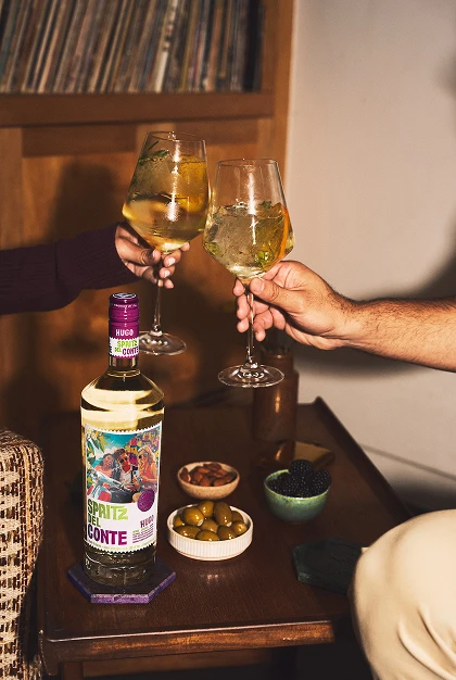 People cheersing glasses of Hugo Spritz