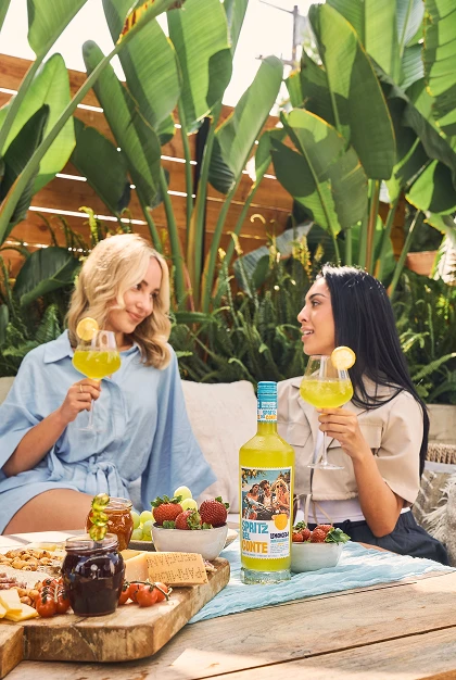 Two people enjoying Spritz Del Conte Lemoncello non-alcoholic