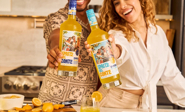People holding bottles of Lemoncello and Lemoncello non-alcholic