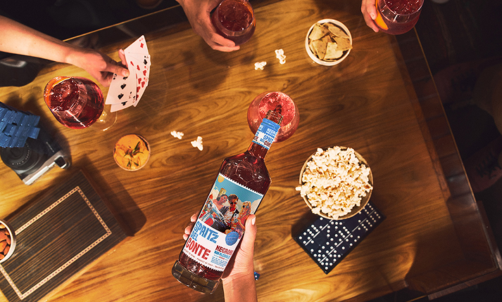 A group enjoying Negroni Non-Alcoholic during game night