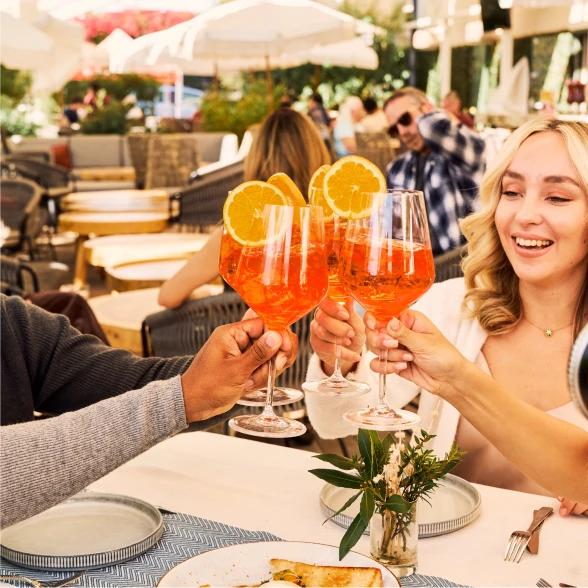A group people enjyoing Spritz Classico in a restaurant